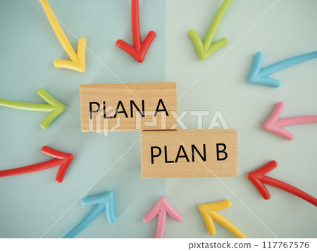 The letters PLAN A and PLAN B surrounded by colorful arrows 117767576