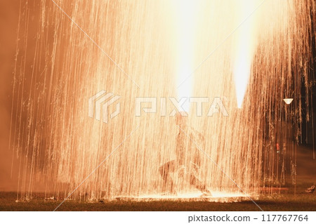 Hand-held fireworks showering with fantastic light Hand-held fireworks showering with fantastic light 117767764