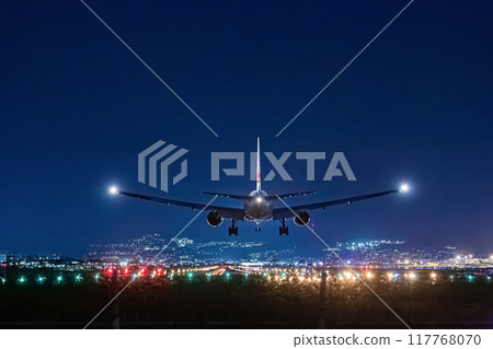 Plane landing at Itami Airport at night 117768070