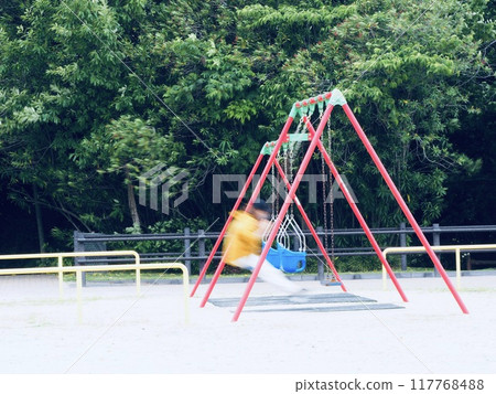 A person swinging on a swing 117768488
