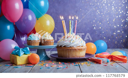 A birthday celebration scene with balloons, a large cupcake with candles, and gifts on a purple background. A birthday celebration scene with balloons, a large cupcake with candles, and gifts on a purple background. 117768579
