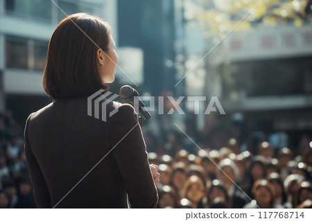 A female politician giving a street speech. 117768714