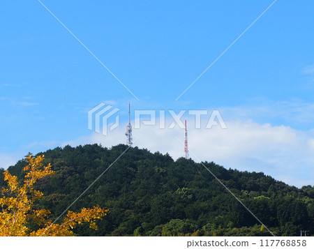 Mountains, blue sky, and radio tower (view of Mt. Eboshi from Kanda Park in late summer) 117768858