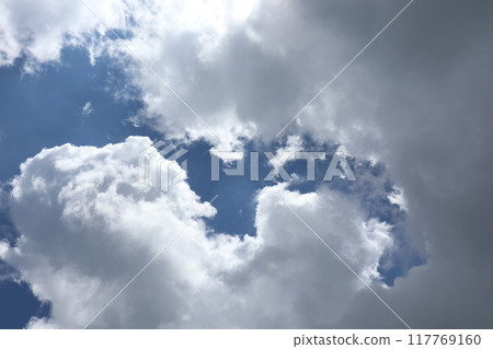 Summer clouds covering the sun 117769160