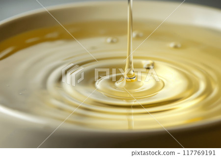 A drop of oil. Liquid. Ripples. 117769191