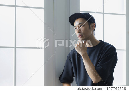 Man in cap Man in cap 117769228