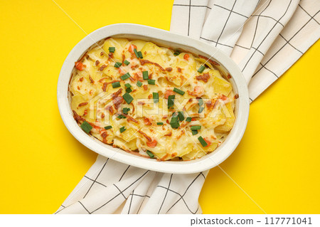Concept of tasty and delicious homemade food - potato casserole Concept of tasty and delicious homemade food - potato casserole 117771041