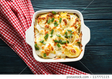 Concept of tasty and delicious homemade food - potato casserole Concept of tasty and delicious homemade food - potato casserole 117771115