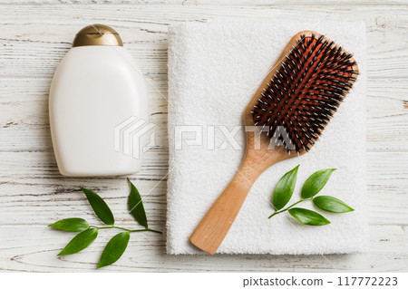 cosmetic for hair care, cream and towel on a colored background top view. flat lay 117772223