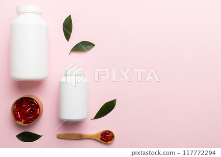 different drugs and health supplement pills with medicine bottle health care and medical top view. Vitamin tablets. Bottle with colored pills on table background. Multivitamins different drugs and health supplement pills with medicine bottle health care and medical top view. Vitamin tablets. Bottle with colored pills on table background. Multivitamins 117772294