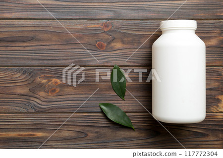 supplement pills with medicine bottle health care and medical top view. Vitamin tablets. Top view mockup bottle for pills and vitamins with green leaves, natural organic bio supplement, copy space supplement pills with medicine bottle health care and medical top view. Vitamin tablets. Top view mockup bottle for pills and vitamins with green leaves, natural organic bio supplement, copy space 117772304