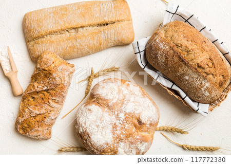 Freshly baked bread on basket against natural background. top view bread copy space Freshly baked bread on basket against natural background. top view bread copy space 117772380