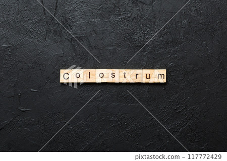 colostrum word written on wood block. colostrum text on table, concept colostrum word written on wood block. colostrum text on table, concept 117772429