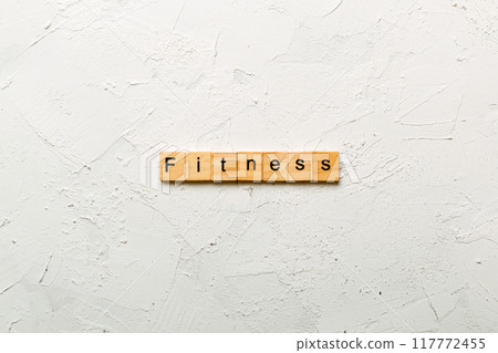 fitness word written on wood block. fitness text on table, concept 117772455
