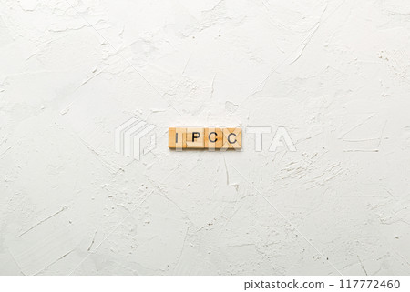 IPCC word written on wood block. abbreviation Intergovernmental Panel on Climate Change text on cement table for your desing, concept IPCC word written on wood block. abbreviation Intergovernmental Panel on Climate Change text on cement table for your desing, concept 117772460