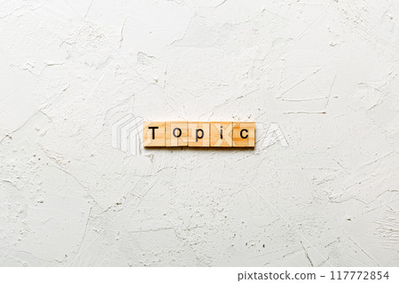 topic word written on wood block. topic text on cement table for your desing, concept topic word written on wood block. topic text on cement table for your desing, concept 117772854