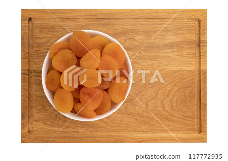dried apricots in bowl isolated on white dried apricots in bowl isolated on white 117772935