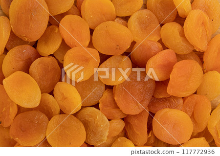 heap of dried apricots close-up, background of dried fruits heap of dried apricots close-up, background of dried fruits 117772936