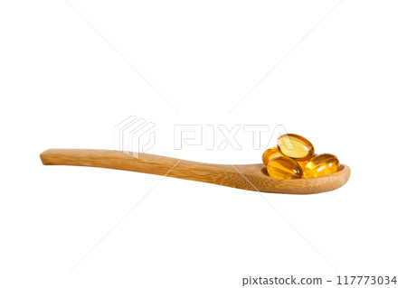 Vitamin omega capsules in a spoon on a colored background. Pills served as a healthy meal. Red soft gel vitamin supplement capsules on spoon Vitamin omega capsules in a spoon on a colored background. Pills served as a healthy meal. Red soft gel vitamin supplement capsules on spoon 117773034