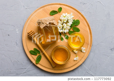 honey jar with acacia flowers and leaves. fresh honey top view flat lay 117773092