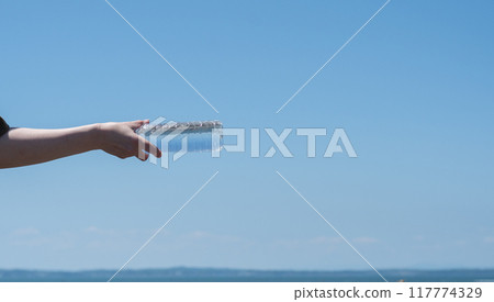 Throwing and receiving plastic bottles 117774329