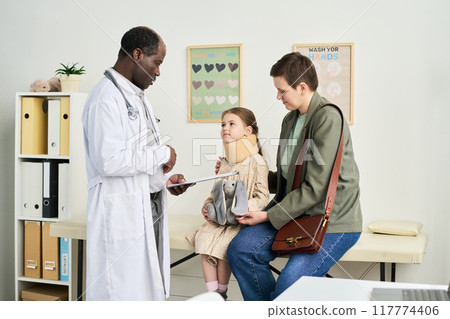 Discussing Health With Pediatric Patient in Medical Office Discussing Health With Pediatric Patient in Medical Office 117774406