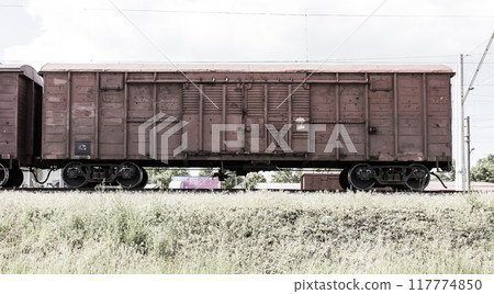 railway freight car on tracks 117774850