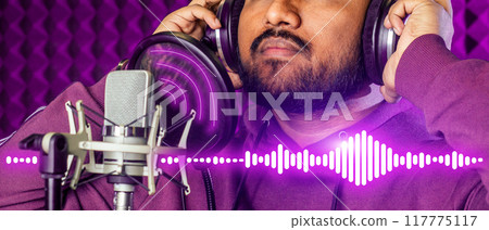 A man wearing headphones is recording a song A man wearing headphones is recording a song 117775117