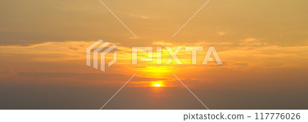 The morning sky looked like a bright sky. Wide photo. The sunrise is decorated with clouds in various shapes. 117776026