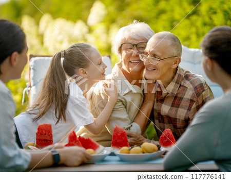 family spending time together in summer morning family spending time together in summer morning 117776141