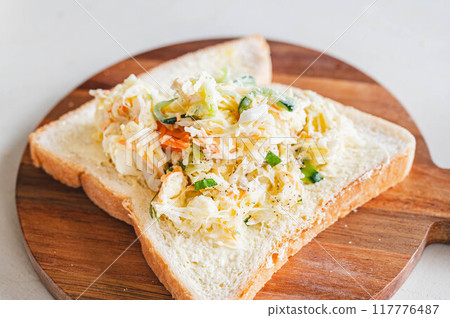 Coleslaw sandwich making 117776487