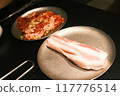 Bacon baked in a frying pan 117776514