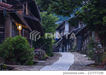 Japan: The stone-paved slopes and streetscape of Magome-juku, a post town on the Nakasendo road in Nakatsugawa City, Gifu Prefecture, at dusk 117777190