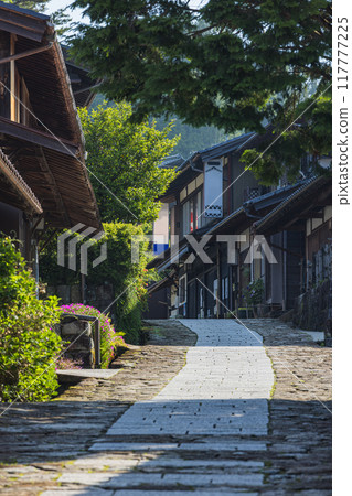 Japan: Stone-paved slopes and houses of Magome-juku, a post town on the Nakasendo road in Nakatsugawa City, Gifu Prefecture 117777225