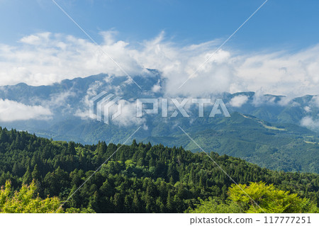 Mount Ena as seen from the Jinbakami Observatory in Magome-juku, a town on the Nakasendo road in Nakatsugawa City, Gifu Prefecture, Japan Mount Ena as seen from the Jinbakami Observatory in Magome-juku, a town on the Nakasendo road in Nakatsugawa City, Gifu Prefecture, Japan 117777251