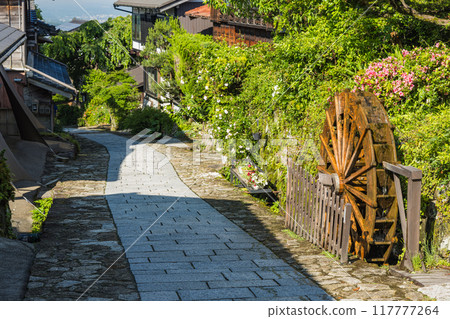 Japan: The hills, streetscape and waterwheel of Magome-juku, a post town on the Nakasendo road in Nakatsugawa City, Gifu Prefecture 117777264