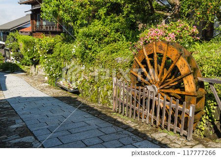 Japan: The hills, streetscape and waterwheel of Magome-juku, a post town on the Nakasendo road in Nakatsugawa City, Gifu Prefecture 117777266