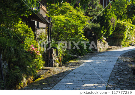 Japan: The stone-paved slopes and streetscape of Magome-juku, a post town on the Nakasendo road in Nakatsugawa City, Gifu Prefecture 117777289