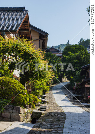 Japan: The stone-paved slopes and streetscape of Magome-juku, a post town on the Nakasendo road in Nakatsugawa City, Gifu Prefecture Japan: The stone-paved slopes and streetscape of Magome-juku, a post town on the Nakasendo road in Nakatsugawa City, Gifu Prefecture 117777291
