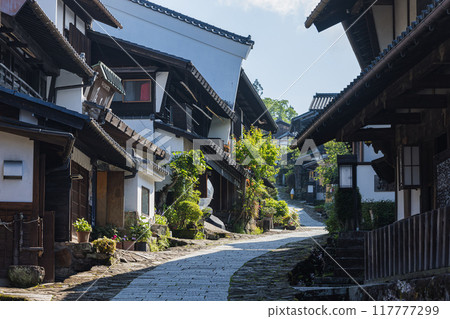 Japan: The stone-paved slopes and streetscape of Magome-juku, a post town on the Nakasendo road in Nakatsugawa City, Gifu Prefecture 117777299