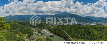 View of the city, Mt. Ena, and the Kiso River from the observation deck of the castle tower of Naegi Castle in Nakatsugawa City, Gifu Prefecture, Japan 117777480