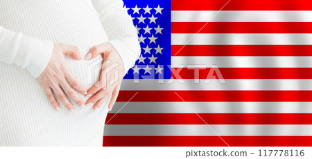 Demographics, pregnancy and love baby in USA concept. Pregnant woman making heart  117778116