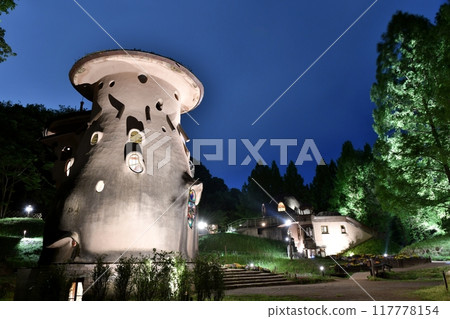 Akebono Children's Forest Park during Golden Week, with the illuminated mushroom house shining against the blue hour night sky 117778154