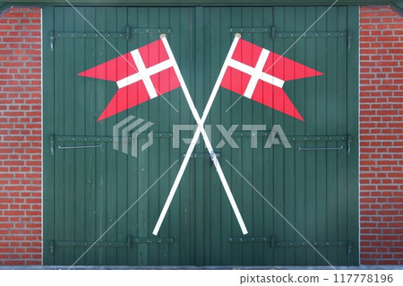 Door of a rescue station with Danish flags in Denmark Door of a rescue station with Danish flags in Denmark 117778196