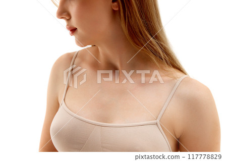 Cropped Image of female body, breast. model posing in underwear, isolated on white background. Health awareness, plastic surgery Cropped Image of female body, breast. model posing in underwear, isolated on white background. Health awareness, plastic surgery 117778829