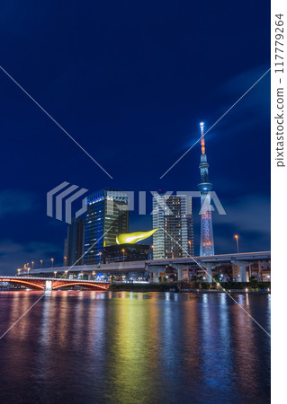 Night view along the Sumida River in Asakusa, Taito Ward, Tokyo, Japan, and the illuminated Tokyo Skytree 117779264