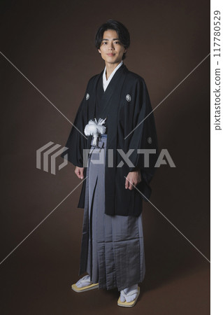 A young man in a hakama with family crest A young man in a hakama with family crest 117780529