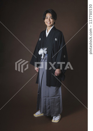 A young man in a hakama with family crest 117780530