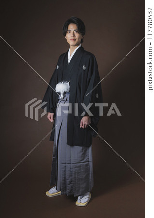 A young man in a hakama with family crest 117780532