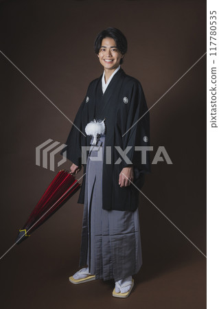 A young man in a hakama with family crest A young man in a hakama with family crest 117780535